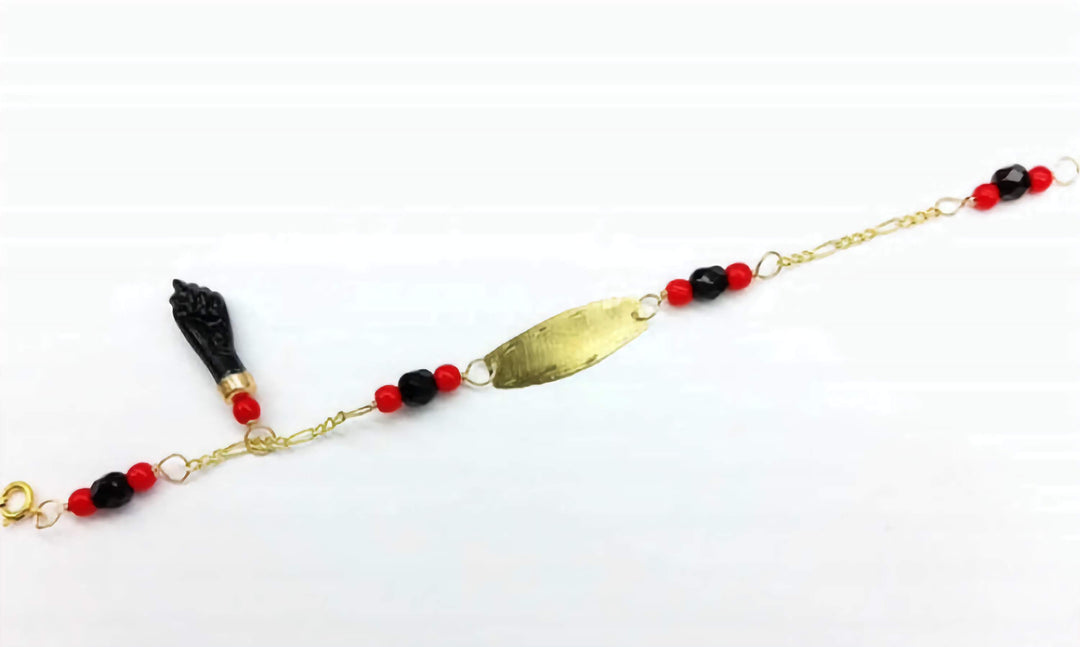 Solid 10K Gold Azabache Bracelet for babies to protect them from the evil eye with black and red beads and nameplate for engraving. 5 inches length.