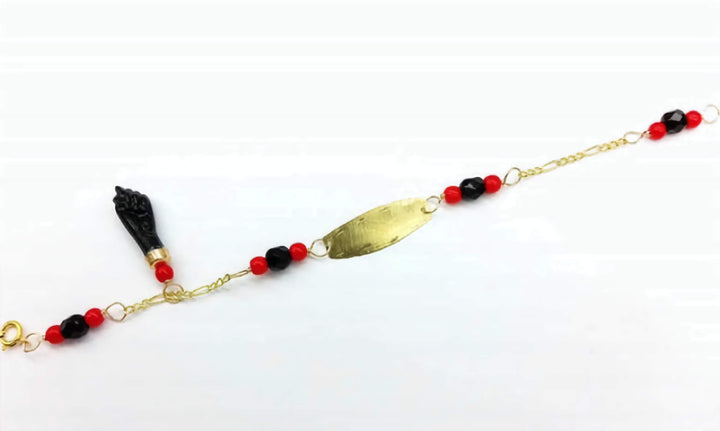 Solid 10K Gold Azabache Bracelet for babies to protect them from the evil eye with black and red beads and nameplate for engraving. 5 inches length.
